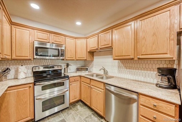 23004 US Highway 6 Unit 103, Dillon, CO 80435 - kitchen with stainless steel appliances, light brown cabinetry, tasteful backsplash, and light stone countertops