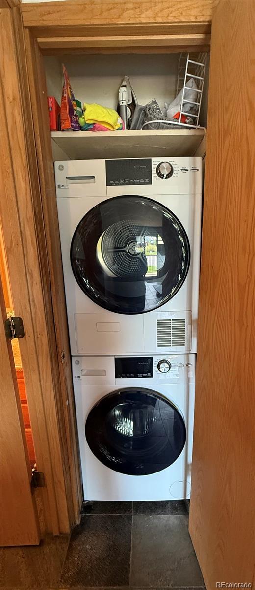 23004 US Highway 6 Unit 103, Dillon, CO 80435 - laundry room with stacked washer / drying machine