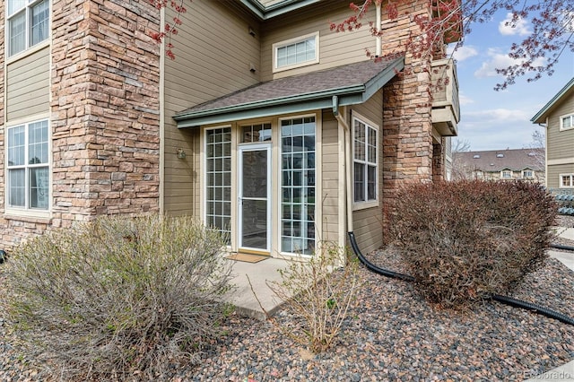 2824 W Centennial Dr Unit L, Littleton, CO 80123 - view of side of property with stone siding