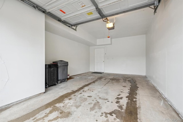 2824 W Centennial Dr Unit L, Littleton, CO 80123 - garage featuring a wood stove and a garage door opener