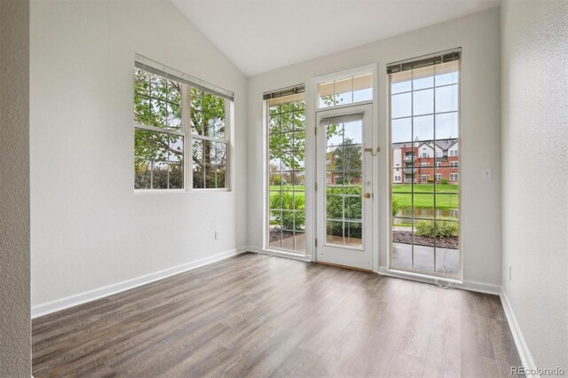 2824 W Centennial Dr Unit L, Littleton, CO 80123 - spare room featuring lofted ceiling, baseboards, and wood finished floors