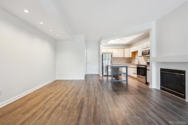 2824 W Centennial Dr Unit L, Littleton, CO 80123 - living area with dark wood-style flooring, baseboards, recessed lighting, and a glass covered fireplace