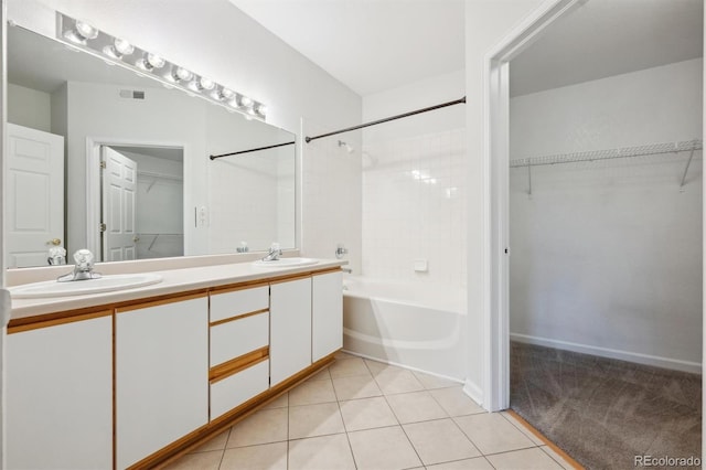 2824 W Centennial Dr Unit L, Littleton, CO 80123 - bathroom with tile patterned floors, double vanity, a spacious closet, and bathtub / shower combination