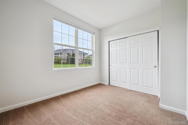 2824 W Centennial Dr Unit L, Littleton, CO 80123 - unfurnished bedroom with carpet flooring, baseboards, and a closet