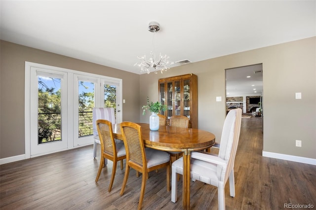 5 Sanford Rd, Colorado Springs, CO 80906 - dining area featuring a chandelier, wood finished floors, and baseboards