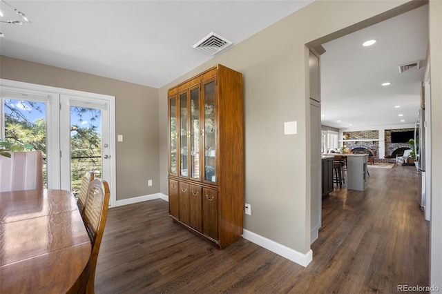 5 Sanford Rd, Colorado Springs, CO 80906 - foyer entrance with dark wood finished floors, baseboards, a fireplace, and recessed lighting