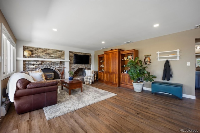 5 Sanford Rd, Colorado Springs, CO 80906 - living room featuring a brick fireplace, wood finished floors, recessed lighting, and baseboards
