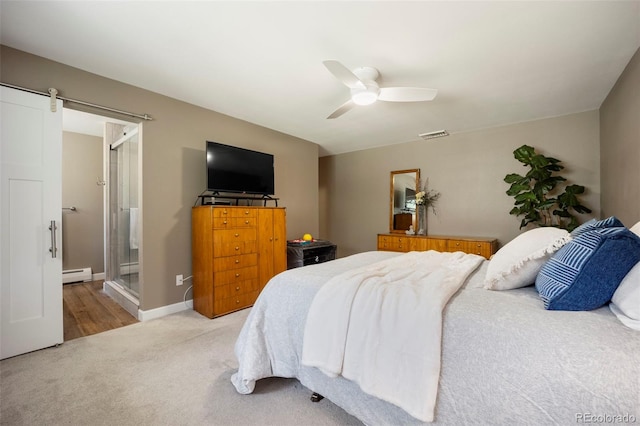 5 Sanford Rd, Colorado Springs, CO 80906 - bedroom featuring a baseboard radiator, carpet, a barn door, ceiling fan, and baseboards