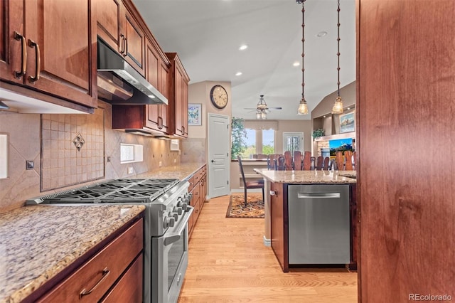 8070 W Progress Cir, Littleton, CO 80123 - kitchen featuring appliances with stainless steel finishes, under cabinet range hood, light wood finished floors, a ceiling fan, and backsplash