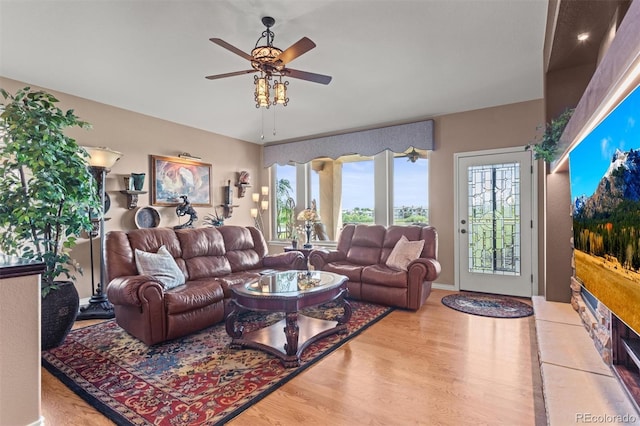 8070 W Progress Cir, Littleton, CO 80123 - living area featuring ceiling fan, wood finished floors, and healthy amount of natural light