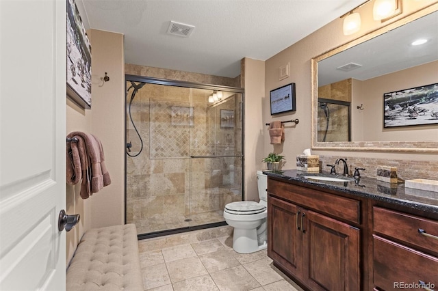8070 W Progress Cir, Littleton, CO 80123 - bathroom with vanity, a shower stall, tile patterned flooring, and backsplash