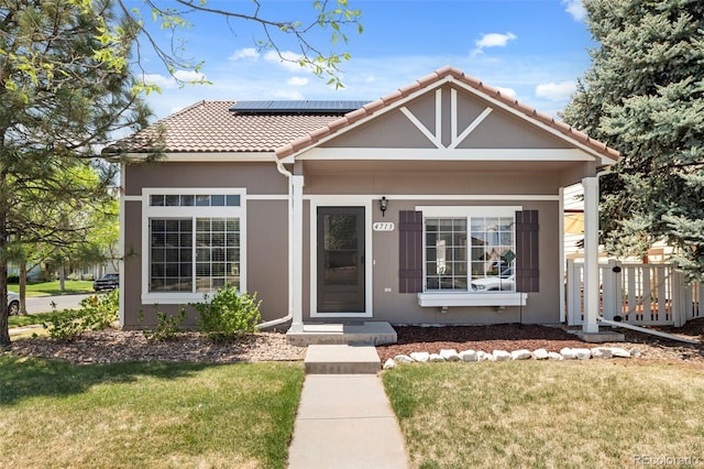 4713 Perth St, Denver, CO 80249 - view of front of home featuring solar panels and a tile roof