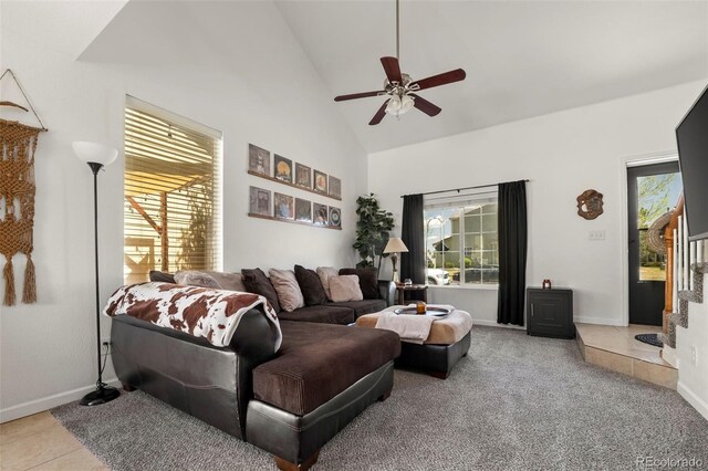 4713 Perth St, Denver, CO 80249 - tiled living room with ceiling fan, high vaulted ceiling, baseboards, and carpet