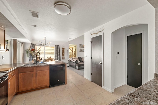 4713 Perth St, Denver, CO 80249 - kitchen with black appliances, brown cabinetry, a peninsula, a textured ceiling, and a sink