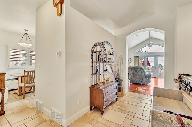 hallway featuring vaulted ceiling