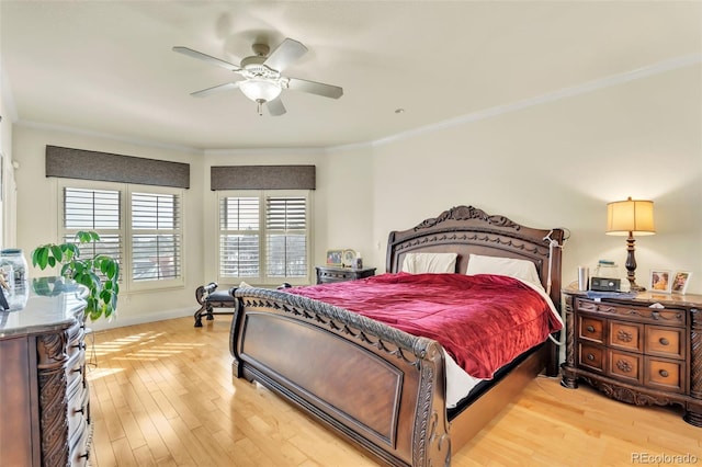 bedroom with crown molding, ceiling fan, and light wood-type flooring