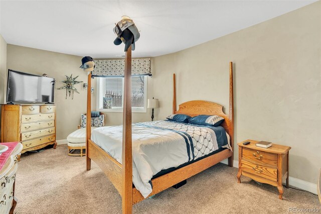 bedroom featuring light colored carpet