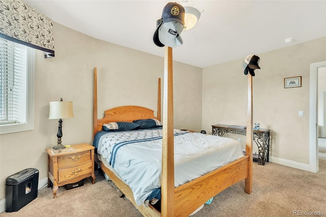 bedroom featuring light colored carpet