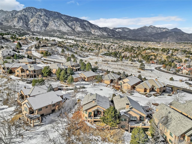 snowy aerial view featuring a mountain view