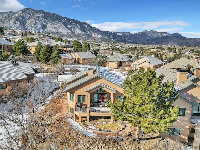 birds eye view of property featuring a mountain view