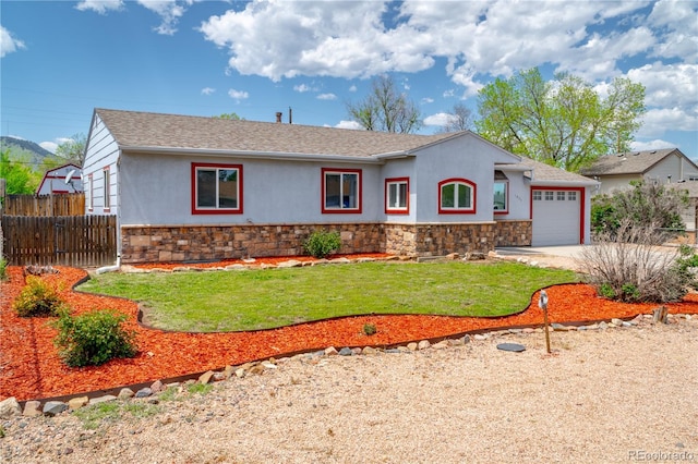 1035 Quartz St, Golden, CO 80401 - single story home with stucco siding, stone siding, an attached garage, and concrete driveway