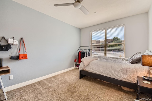 bedroom with carpet, baseboards, and ceiling fan