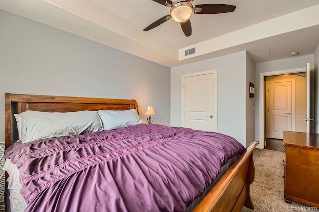 bedroom featuring ceiling fan, visible vents, and carpet flooring