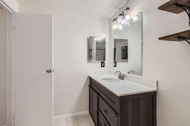 bathroom featuring tile patterned flooring and vanity