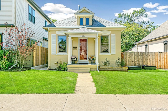 bungalow with a front lawn