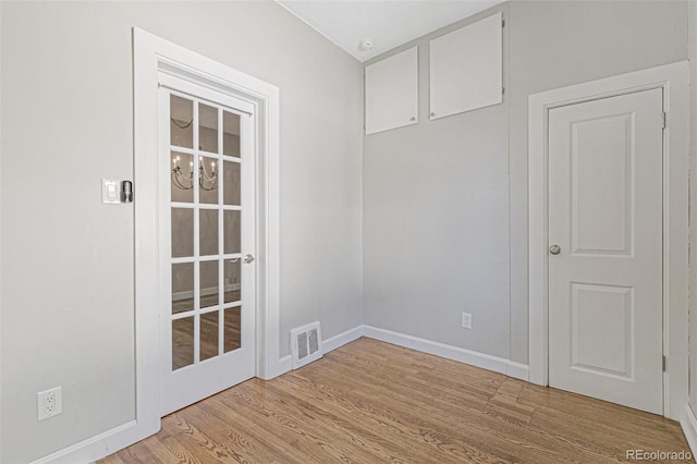 empty room with light hardwood / wood-style floors