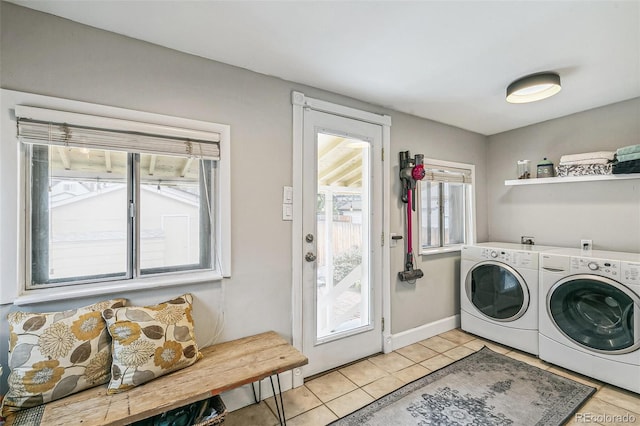 laundry room with separate washer and dryer and light tile patterned floors