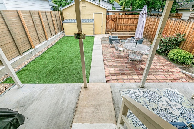 view of patio / terrace with a storage shed