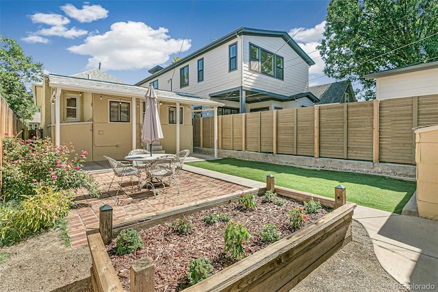 back of house with a patio