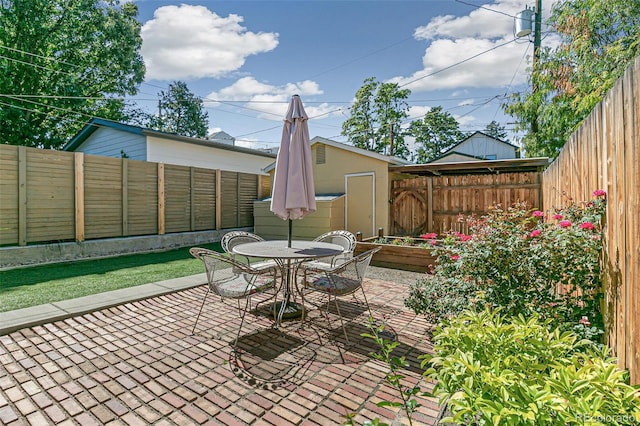 view of patio / terrace featuring a shed