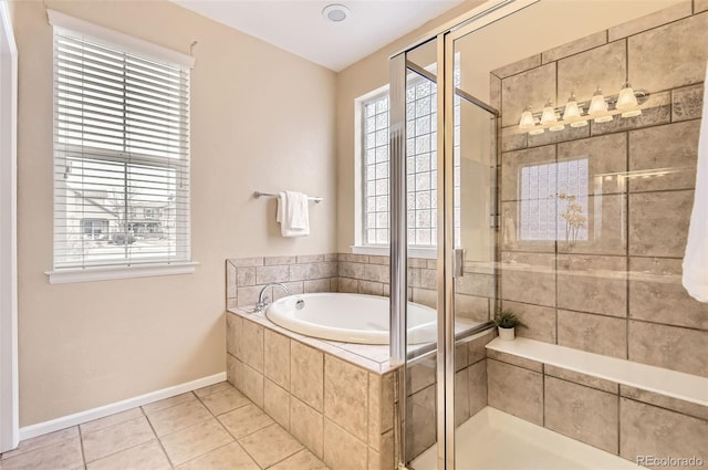 bathroom with tile patterned flooring and plus walk in shower