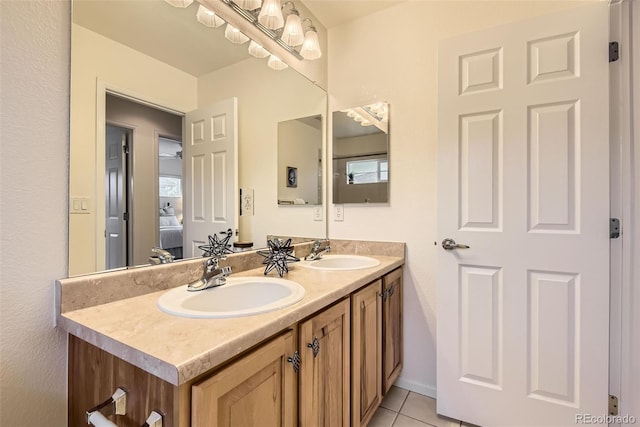 bathroom with tile patterned floors and vanity