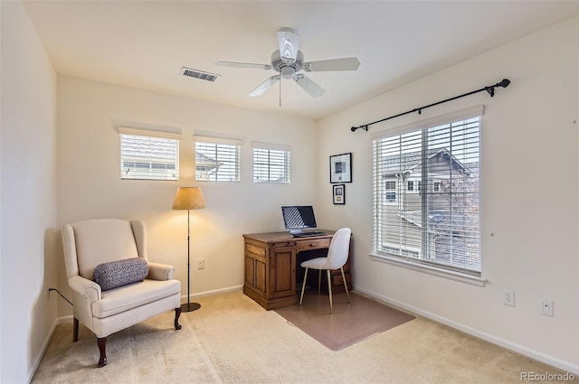 office space featuring carpet and ceiling fan