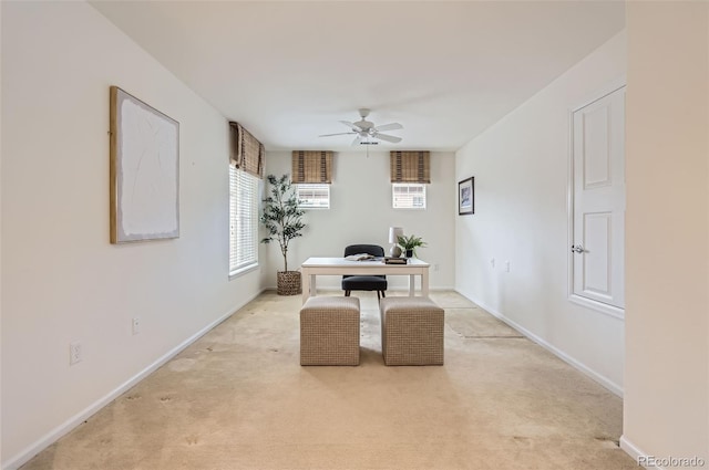 carpeted office with ceiling fan