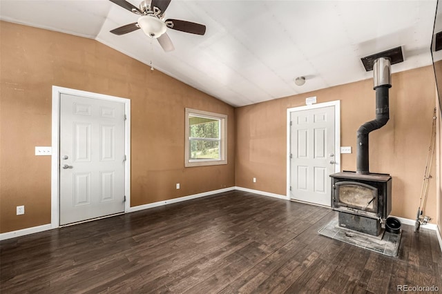 435 Sourwood Ln, Canon City, CO 81212 - unfurnished living room with lofted ceiling, wood finished floors, ceiling fan, and a wood stove