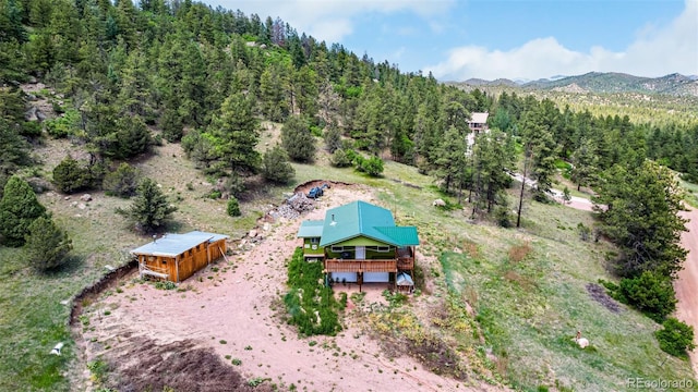 435 Sourwood Ln, Canon City, CO 81212 - aerial view of property and surrounding area featuring a heavily wooded area and mountains