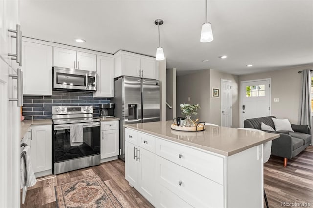 13542 Achilles Dr, Lone Tree, CO 80124 - kitchen featuring stainless steel appliances, recessed lighting, dark wood-style flooring, light countertops, and white cabinetry