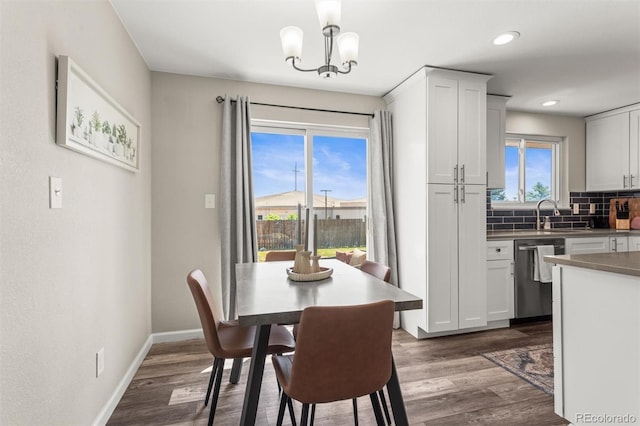 13542 Achilles Dr, Lone Tree, CO 80124 - dining room with dark wood finished floors, a chandelier, and recessed lighting