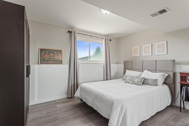 13542 Achilles Dr, Lone Tree, CO 80124 - bedroom featuring wood finished floors and a wainscoted wall