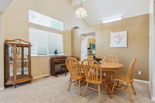 6534 S Union Way, Littleton, CO 80127 - dining space with vaulted ceiling, a chandelier, baseboards, and light colored carpet