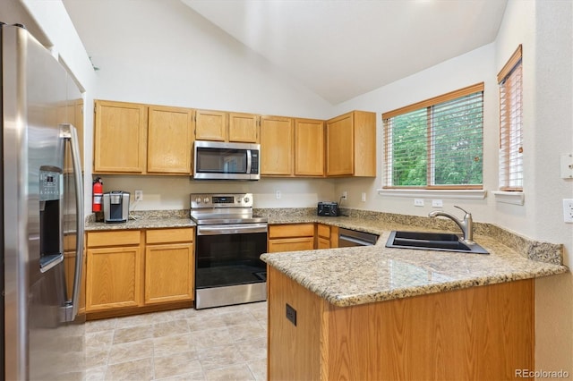 6534 S Union Way, Littleton, CO 80127 - kitchen featuring appliances with stainless steel finishes, a sink, a peninsula, light stone counters, and high vaulted ceiling