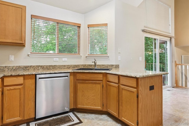 6534 S Union Way, Littleton, CO 80127 - kitchen featuring dishwasher, a sink, light tile patterned floors, and light stone countertops
