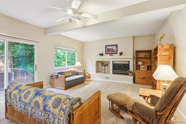 6534 S Union Way, Littleton, CO 80127 - carpeted living room with beam ceiling, a fireplace, baseboards, and a ceiling fan