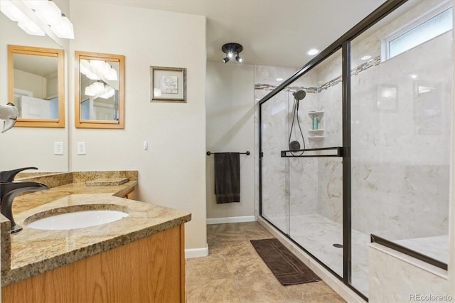 6534 S Union Way, Littleton, CO 80127 - bathroom with a stall shower, vanity, and baseboards
