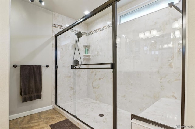 6534 S Union Way, Littleton, CO 80127 - full bathroom featuring a stall shower and baseboards