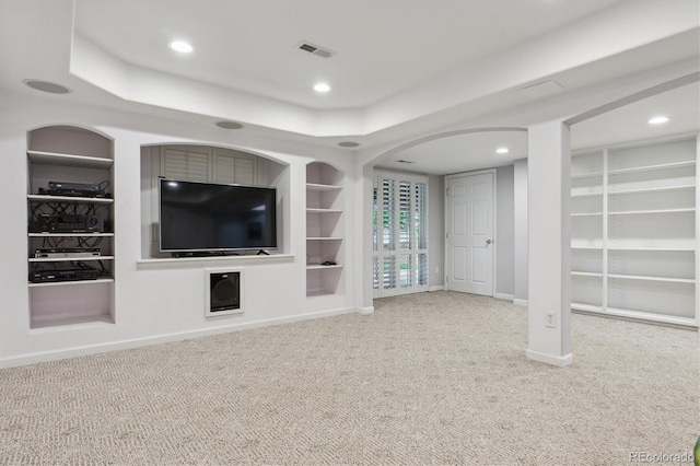 6534 S Union Way, Littleton, CO 80127 - unfurnished living room with built in shelves, carpet, baseboards, recessed lighting, and a tray ceiling